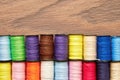 Embroidery template with colorful thread spools in a row Royalty Free Stock Photo