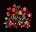 Embroidery with tribal motifs. Bright composition with flowers and leaves in folk style on black background.