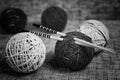 Embroidery wool balls and knitting needles Royalty Free Stock Photo