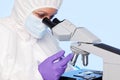 Embryologist extracting a sample using a syringe. Royalty Free Stock Photo