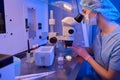 Embryologist preparing cell samples for cryopreservation procedure