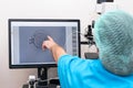 Embryologists perform test with human eggs. Doctor working on manipulator fertilizing human egg in fertility clinic lab,