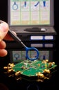 EMC engineer analyzing PCB using near-field probe Royalty Free Stock Photo