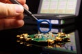 EMC engineer analyzing PCB using near-field probe