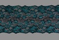 Color straight strip of lace fabric on a gray background. Elastic silk nylon braid border. use for clothes and linen decoration Royalty Free Stock Photo