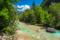 Emerald color Soca river in the green forest, Bovec, Slovenia Royalty Free Stock Photo