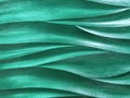 Emerald 3D interior decorative wall panel with wavy pattern. Texture of pearl green background. Abstract backdrop