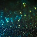 Emerald glitter magic background. Defocused light and free focused place for your design.