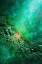 Emerald green crystal surface shining with golden particles Royalty Free Stock Photo