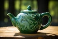 Emerald Green Dragon symbol on traditional Chinese teapot on the table