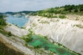 Emerald green and turquoise waters of lakes framed by chalk walls of the hills with deep green plants on its top