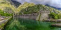 Emerald green waters of Kotor Bay or Boka Kotorska and the ancient wall of Kotor former Venetian fortress in Montenegro