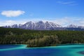 Emerald Lake, Yukon, Canada with mountains and forest on the background Royalty Free Stock Photo