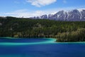 Emerald Lake, Yukon, Canada with mountains and forest on the background Royalty Free Stock Photo