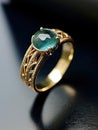 Emerald and platinum gold ring with cross-cut detail in dark aquamarine and gold