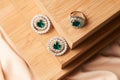 Emerald ring and pair of diamond earrings in gold Royalty Free Stock Photo