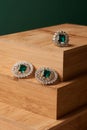 Emerald ring and pair of diamond earrings in gold Royalty Free Stock Photo