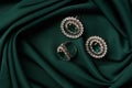 Emerald ring and pair of diamond earrings in gold Royalty Free Stock Photo