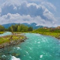 emerald river rushing among mountain valley Royalty Free Stock Photo