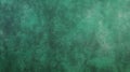 An emerald textured background with a fine, suede-like texture. The matte finish and rich green