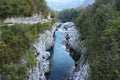 Emerald turquoise transparent water of Soca river from Napoleon Bridge, in Soca Valley, Slovenia Royalty Free Stock Photo