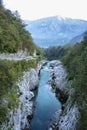 Emerald turquoise transparent water of Soca river from Napoleon Bridge, in Soca Valley, Slovenia Royalty Free Stock Photo