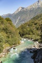 Emerald turquoise transparent water of Soca river in a sunny day, in Soca Valley, Slovenia