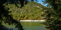 Emerald water of lake in Sukko against background of mountain covered with forests. Natural beauty of resort near Anapa