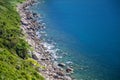 Emerald water and rocky coast of the South China Sea near the resort of Da Nang, Central Vietnam Royalty Free Stock Photo