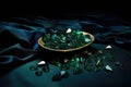 emeralds scattered on dark velvet surface Royalty Free Stock Photo