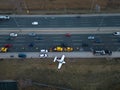 Emergency airplane landing on highway. Above wide Drone shot