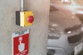 Emergency Alarm button at car park complex for security alert and crime control Royalty Free Stock Photo