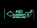 Emergency defibrillator DEA or AED sign lighted Royalty Free Stock Photo