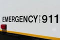 Emergency dial 911 sign on the side of the police car. Close up Royalty Free Stock Photo