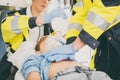 Emergency doctor giving cardiac massage for reanimation in ambulance