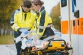 Emergency doctor giving oxygen to accident victim