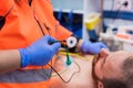Emergency doctor hands, attaching ecg electrodes on patient chest in ambulance Royalty Free Stock Photo