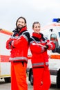 Emergency doctor and paramedic with ambulance