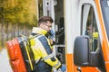 Emergency doctor using radio of ambulance