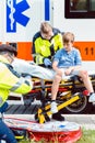 Emergency doctors caring for accident victim boy Royalty Free Stock Photo