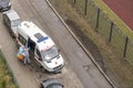 emergency doctors in protective suits get out of an ambulance