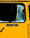 Emergency Door With Smashed Glass On Old School Bus