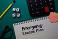 Emergency Escape Plan write on a book isolated on Office Desk Royalty Free Stock Photo