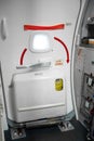 Emergency exit door in an airplane close up