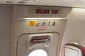 Emergency exit door in an airplane, airplane flight safety concept Royalty Free Stock Photo
