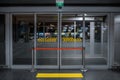 Emergency Exit door in airport terminal, with access to restricteed area. Hospital doors with quarantine warning Royalty Free Stock Photo