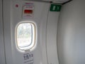 Emergency exit doors on the plane with the door opening method Royalty Free Stock Photo