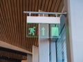 emergency exit sign in a business building, airport Royalty Free Stock Photo