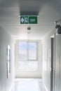 Emergency exit sign / Fire Extinguisher on the corridor in hotel or office building Royalty Free Stock Photo