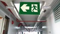 Emergency exit sign in hallway of apartment